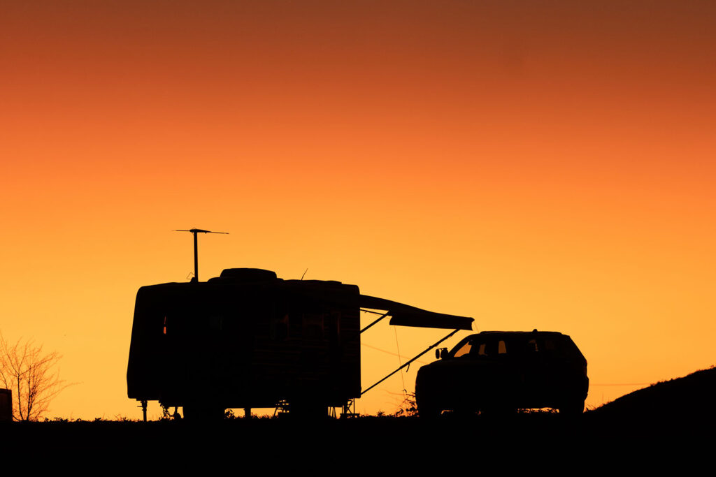 caravan and car in sunset